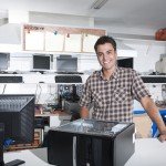 photodune-2562366-happy-owner-of-a-computer-repair-store-s