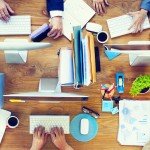 photodune-8797917-group-of-business-people-working-on-an-office-desk-m