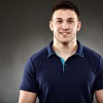 Handsome man wearing a navy blue t-shirt